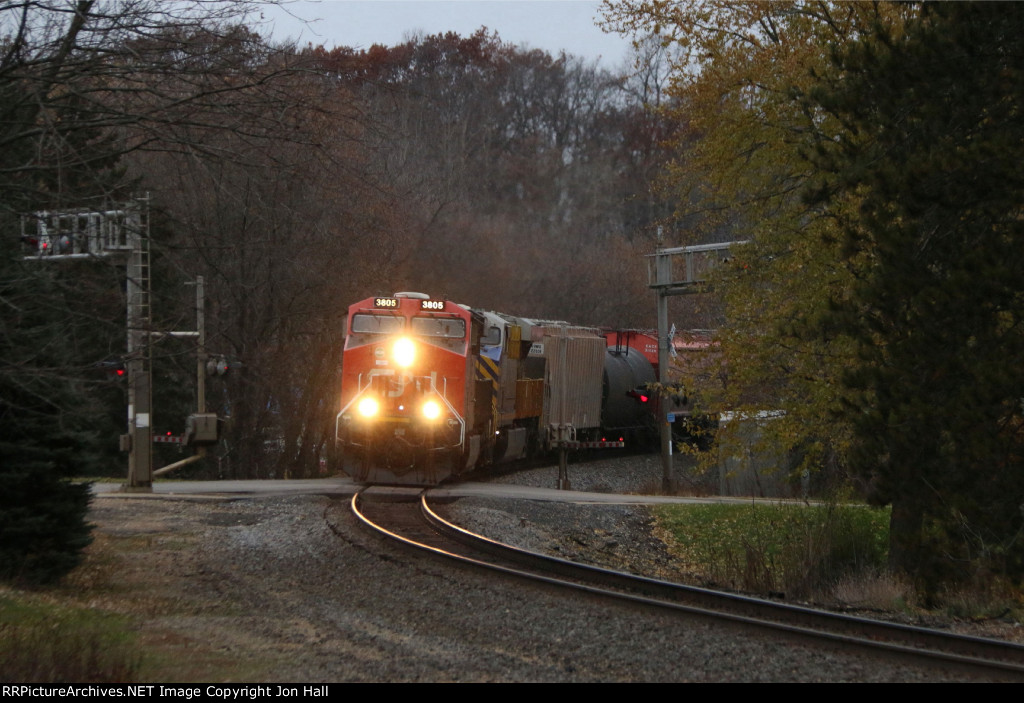 In the limited early morning light, M340 comes rolling around the corner southward